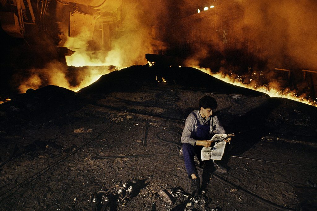 00038_18, MKS Steelworks, Serbia, Yugoslavia, 11/1989, SERBIA-10004. Man takes a break at MKS Steelworks. © Steve McCurry